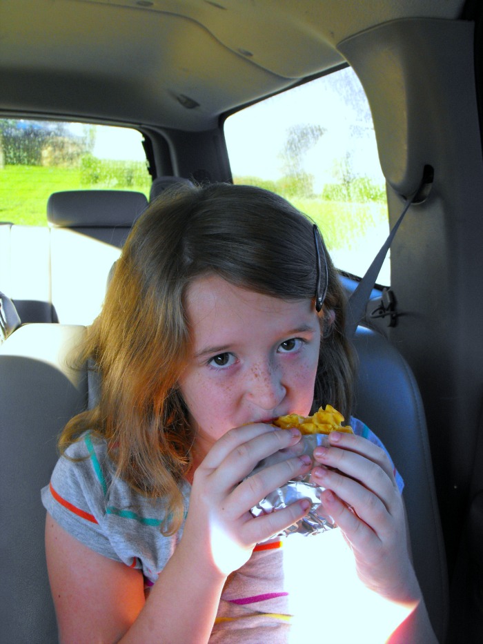 Only Daughter enjoying a Waffle Sausage Sandwich Olè #breakfastonthego #4morewaffles #shop