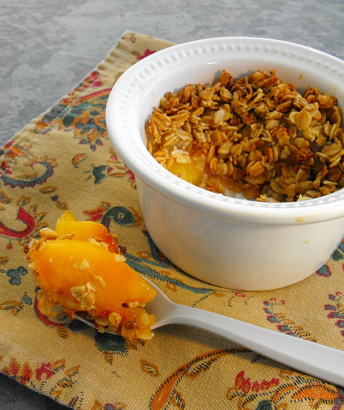Individual serving sized peach crisp is the perfect winter dessert.
