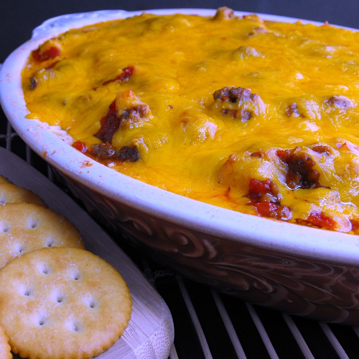 Goulash Dip: layers of ground beef with tomatoes and bell peppers and cheese, lots and lots of cheese!
